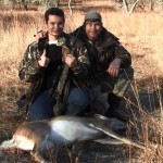 sean and dad hunting doe